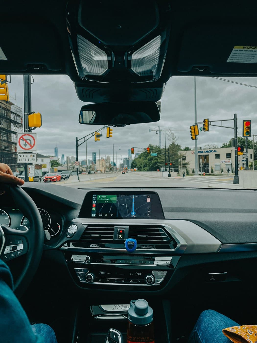 View from inside a car driving through the city with GPS navigation active
