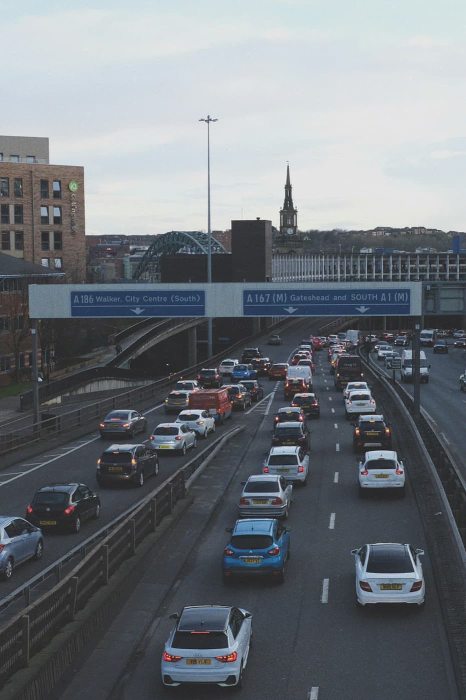 Traffic jam on a highway with exit signage