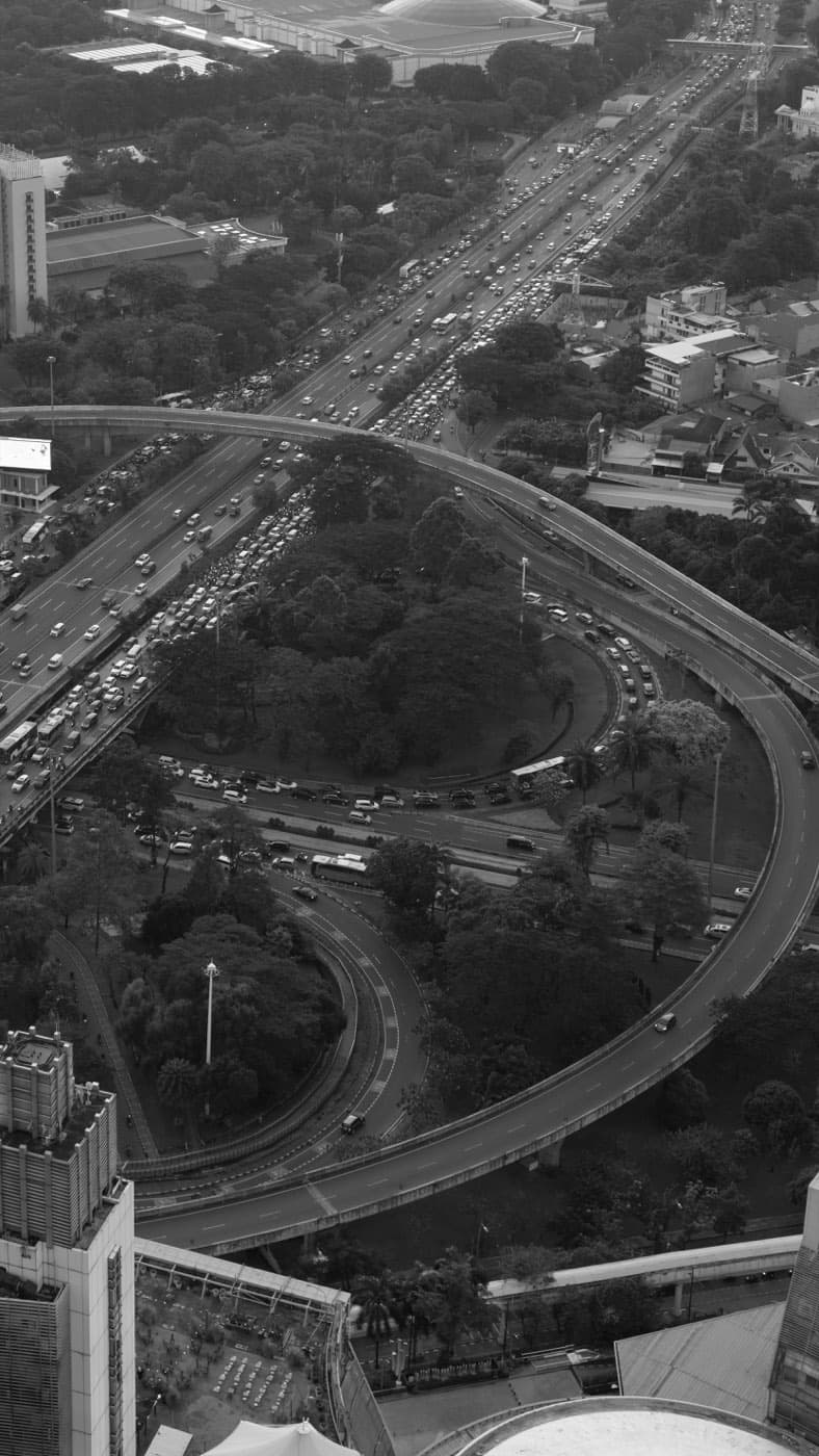 Black and white aerial view of a highway with a traffic jam