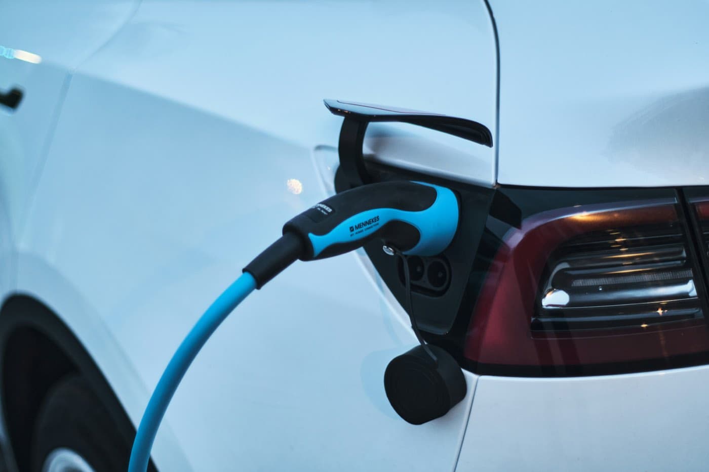 An electric car charging at a street charging point